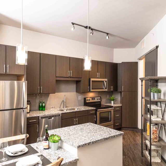 Encore at Forest Park - Modern Kitchen Featuring Granite Countertops