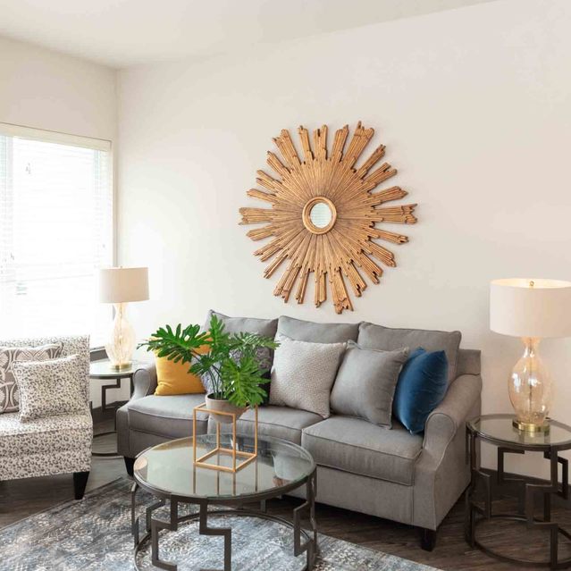 Encore at Forest Park  - Modern Living Room with Gray Sofa and Decorative Pillows