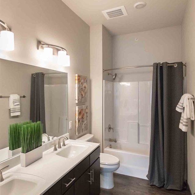 Encore at Forest Park - Modern Bathroom with Dark Wood Vanity