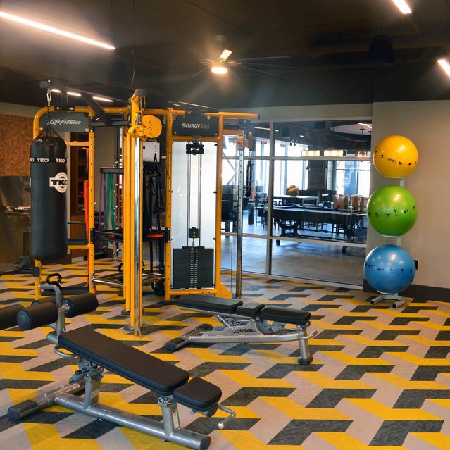 Encore at Forest Park - Modern Fitness Center with Yellow and Black Equipment