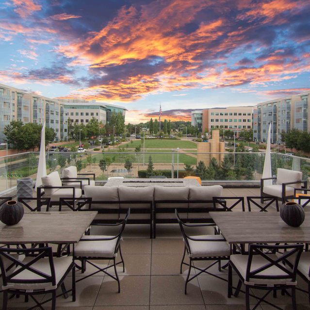Encore at Forest Park - Rooftop Patio With Tables And Chairs